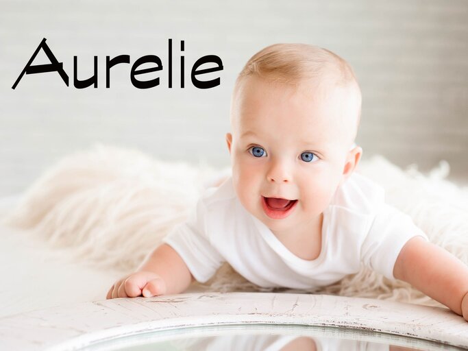 lachendes Baby mit dem Namen Aurelie | © iStock.com | Nagaiets