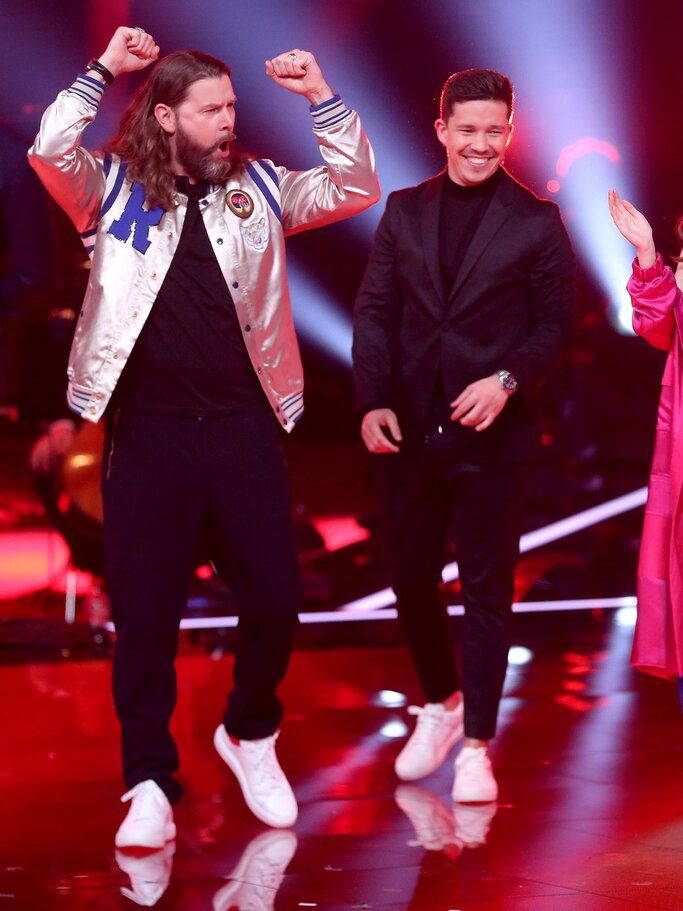 Nico Santos bei "The Voice" mit Rea Garvey | © Getty Images / Adam Berry