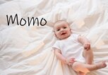 kleines süßes Baby mit dem Namen Momo | © Getty Images/Jamie Grill