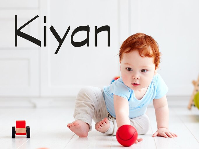 rothaariges Baby mit dem Namen Kiyan | © iStock | olesiabilkei